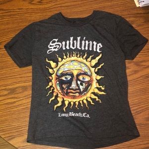 A (XS) women Sublime shirt that is Gray from Spencer’s.